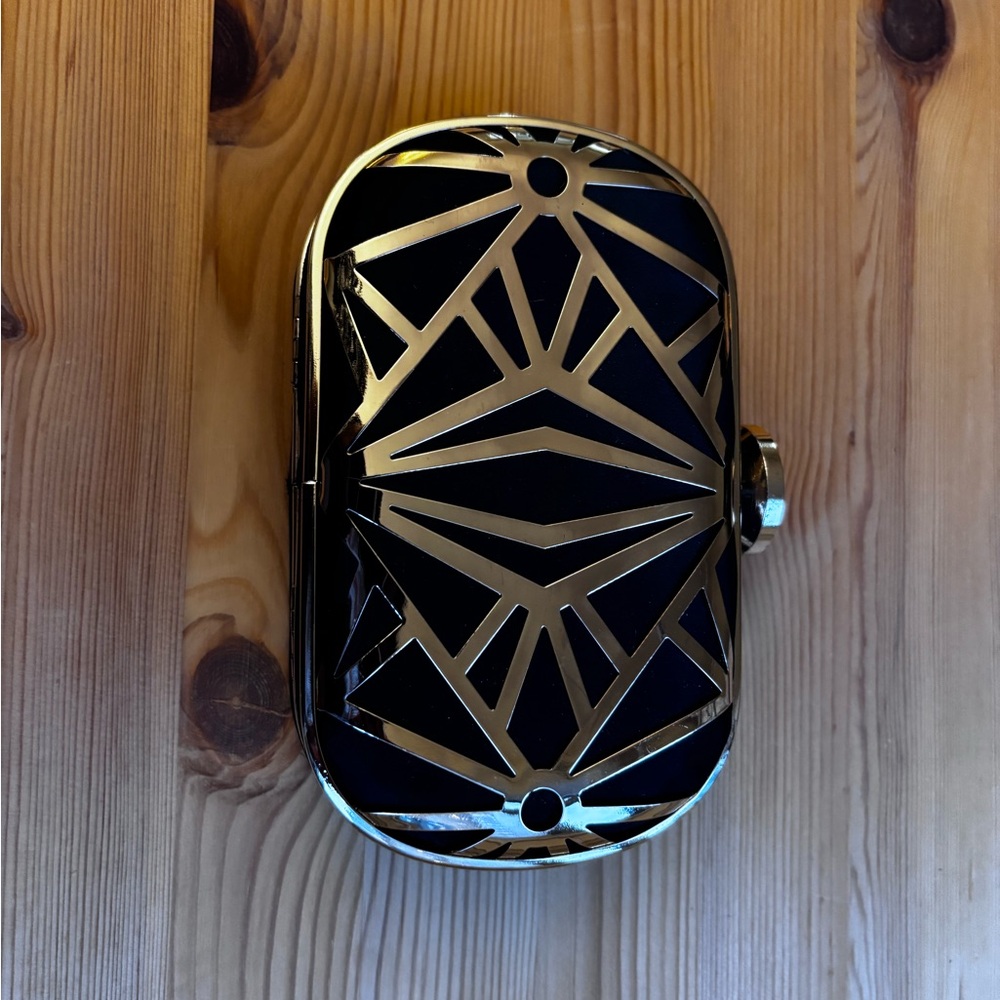Charming Charlie Black and Gold Geometric Wristlet